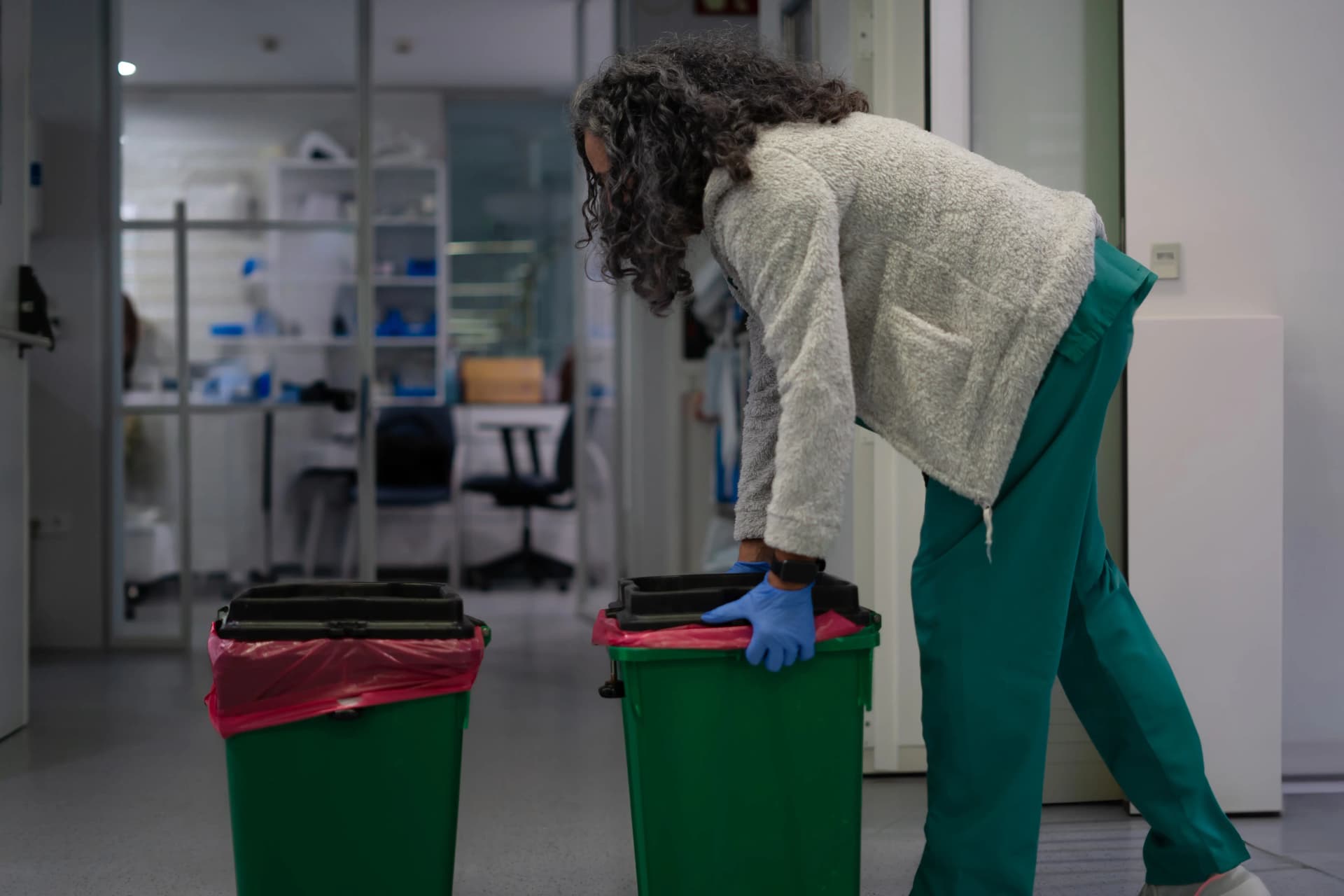 nursing-assistant-disposing-of-products-in-sanitar